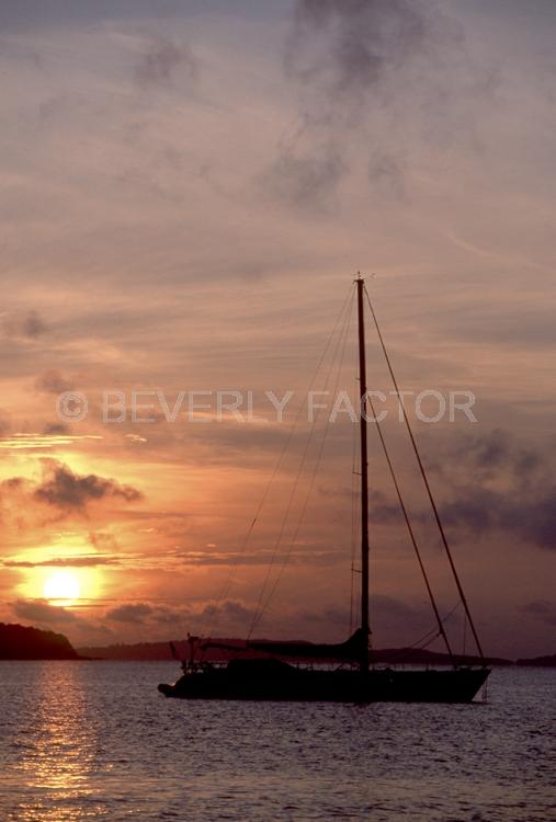 Sunset Island;Thailand;colorful;yellow;sunset;sky;water;boat;pink;sillouettes;sail boat
